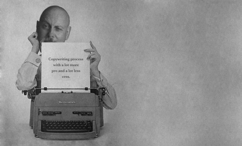 Jonathan Wilcock at the typewriter. He has just typed, 'Copywriting process with a lot more pro and a lot less cess.