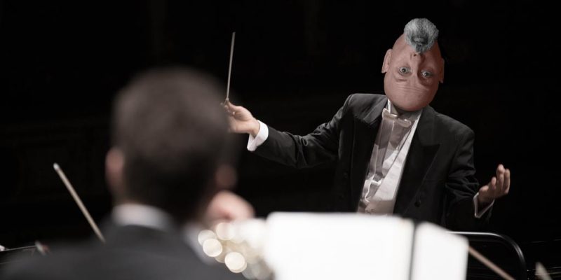 How I run my copywriting business – picture of Jonathan Wilcock conducting and orchestra.