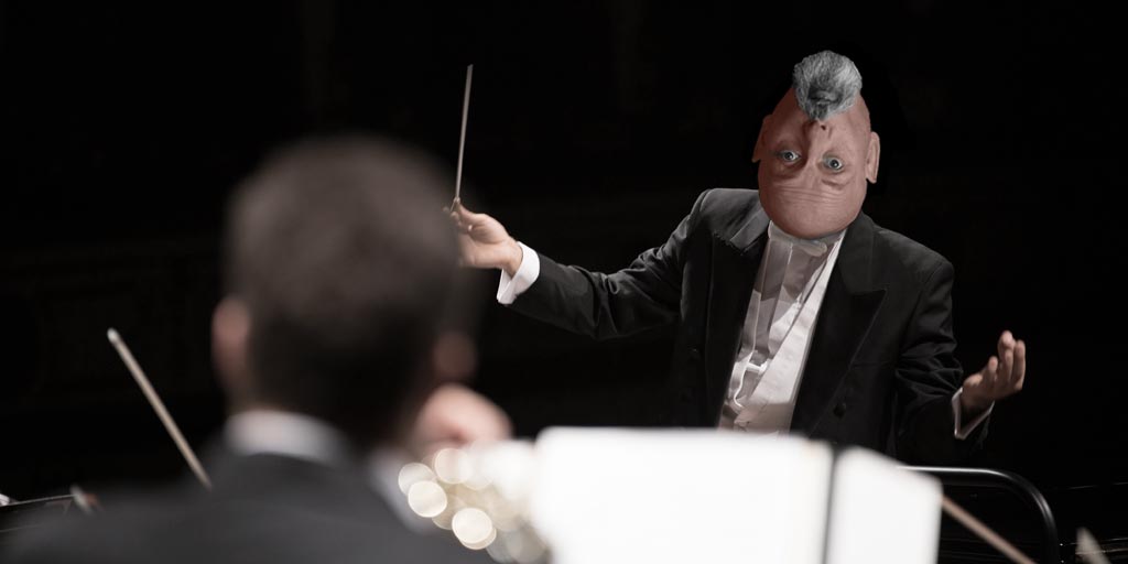 How I run my copywriting business – a picture of Jonathan Wilcock conducting an orchestra.