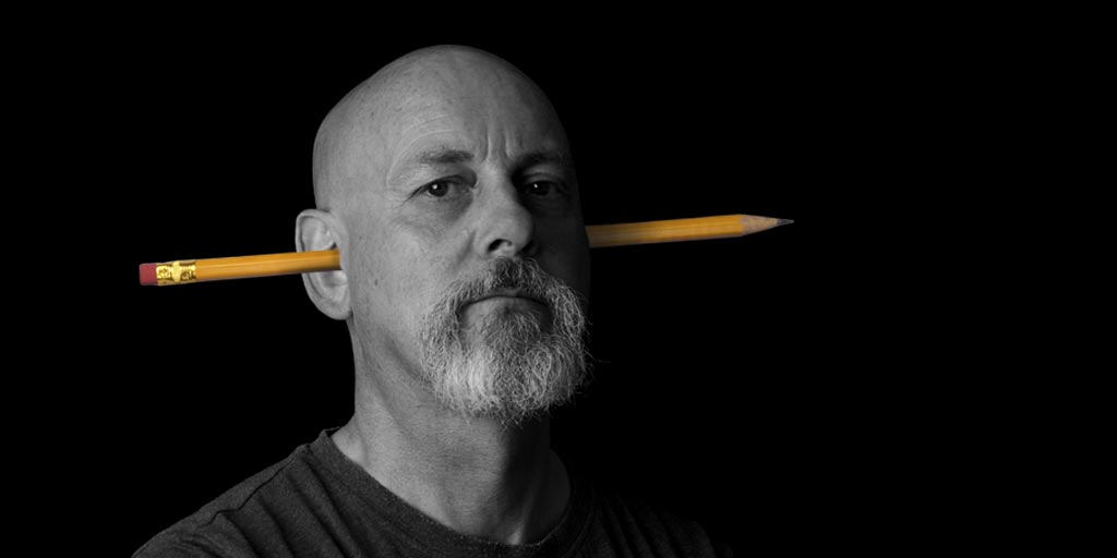 The Author, Jonathan Wilcock, with a pencil stuck in his ear